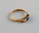 Skandinavisk guldsmed. Vintage ring i 14 karat guld prydet med tre halvædelsten. 
Midt 1900-tallet.

