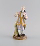 Antique Meissen porcelain figure. Noble gentleman with gold watch. Late 19th 
century.
