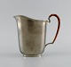 Just Andersen (1884-1943), Denmark. Art deco tin water jug with wicker handle. 
1940s. Model number 2500.
