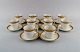 Royal Copenhagen service no. 607. 10 coffee cups with saucers. Gold border with 
foliage. 1960s. Model number 607/9481.
