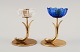 Gunnar Ander for Ystad Metall. Two candlesticks in brass and blue/white art 
glass shaped like flowers. The 1950s.