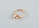 Danish goldsmith, modernist 14 carat gold ring adorned with a cultured pearl.
Marked with the goldsmith