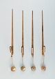 Skultuna, Sweden, four brass candlesticks for wall hanging.
Designer: Pierre Forsell.