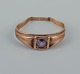 Danish goldsmith. Gold ring with purple semi-precious stone in art deco design.