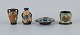 Gouda, Holland, art nouveau hand decorated ceramics.
Four miniature vases and bowl.