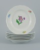Meissen, Germany, six dinner plates hand painted with floral motifs in different 
colors.