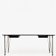 Roxy Klassik presents: Arne Jacobsen / Fritz HansenDesk in rosewood with black lacquered drawers, chromed ...
