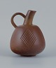 Nils Thorsson (1898-1975) for Royal Copenhagen, stoneware jug with brownish 
glaze.