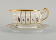 Royal Copenhagen Henriette, hand-painted porcelain with gold rim, sauce bowl on 
fixed stand.