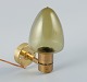 Hans Agne Jakobsson, Sweden, a wall sconce in brass and smoked glass.