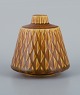 Gunnar Nylund for Rörstrand, "Eterna" ceramic vase with glaze in yellow-brown 
shades.