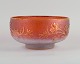 Daum, Nancy, France. Large art glass bowl in pink and gold with floral motif.