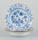 Meissen, Germany, a set of three deep plates, Blue Onion pattern porcelain 
plates with gold rim.