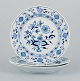 Meissen, Blue Onion pattern, a set of three hand painted dinner plates.
Early 20th century.