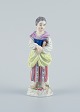 Meissen, Germany, porcelain figure. Overglaze.
Young woman with book.