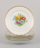 Bing & Grøndahl, six porcelain lunch plates hand-painted with polychrome flowers 
and gold decoration.