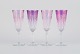 Four French champagne flutes in crystal glass.
Classic design in purple glass.