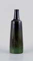 Carl Harry Stålhane for Rörstrand, bottle-shaped ceramic vase decorated in 
shades of green.