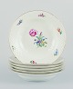 Bing & Grøndahl, Saxon Flower, a set of six deep plates hand-decorated with 
polychrome flowers and gold rim.