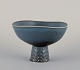 Carl Harry Stålhane for Rörstrand, Sweden. Ceramic bowl on a pedestal.
Glaze in blue tones.