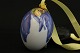 Seasonal egg from Flora Royal Copenhagen, with a nice colorful motif and yellow 
ribbon.
SOLD