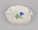 Meissen, Germany. Leaf-shaped porcelain dish. Hand-painted with polychrome 
flower motifs.