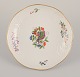 Meissen, Germany. Bowl hand-painted with a butterfly on a branch and polychrome 
flower motifs. Gold rim.