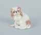 Dahl-Jensen for Bing & Grøndahl, small porcelain figurine of a sitting Pekingese 
dog.