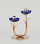 L'Art presents: Gunnar Ander for Ystad Metall, Sweden. Candlestick holder in brass and blue art glass shaped ...