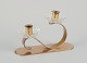 L'Art presents: Gunnar Ander for Ystad Metall, Sweden. Candlestick holder in brass and clear art glass shaped ...