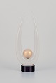 Archimede Seguso for Murano, Italy. Large art glass sculpture.
Clear glass on a black base with a gold-colored sphere. Mouth-blown.