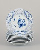 Meissen, Germany. A set of eight open lace Blue Onion plates, adorned with 
hand-painted flower motifs and insects.