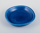 L'Art presents: 
Nils 
Thorsson for 
Aluminia. 
Faience bowl 
with blue 
glazed finish. 
Featuring a 
fish motif.