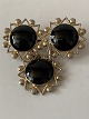 Antik Huset 
presents: 
Silver 
brooch with 
beautiful black 
stones and star 
pattern. 
Stamped ANH, 
830s
