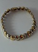 Gold bracelet in 18 carat red and white gold, stamped 750, and with box lock