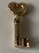 Pendant shaped like a key, in 14 carat gold and stamped BBO 585