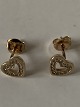 9 karat Gold heart earrings
with clear stones.