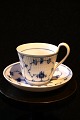 Royal Copenhagen Blue Fluted Plain high-handled coffee cup with saucer. 
Decoration number: 093 / 094.
Personnel sorting - 3rd sort. Painted in Denmark. - older stamp
Cup H: 9cm. Dia.. 8.5cm. The saucer Dia.: 15.5 cm.
The cup has a brown burn spot inside the cup itself, see extra picture.
Otherwise, the set is complete and in good condition.
Item number: RC# 093 / 094