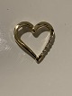 Pendant 14 carat gold, designed as a Heart
with embedded diamonds.