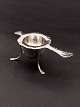 Silver French 
lily  tea 
strainer