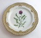 Royal Copenhagen, Flora Danica. Frokost tallerken med gennemskåret bort. Design 
#3554. Diameter 23 cm. (1 sortering). Astragalus danicus Retz