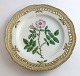 Lundin Antique 
præsenterer: 
Royal 
Copenhagen, 
Flora Danica. 
Frokost 
tallerken med 
gennemskåret 
bort. Design 
...