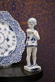 K&Co. presents: 
Royal 
Copenhagen, 
small Blue 
Fluted girl 
with butterfly. 

1/4795...