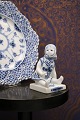 K&Co. presents: 
Royal 
Copenhagen, 
small Blue 
Fluted sitting 
girl. 
1/4793...