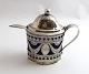 Lundin Antique 
presents: 
Erik 
Stridbeck, 
Copenhagen. 
Silver mustard 
jug with blue 
glass. Height 
11 cm. Produced 
...
