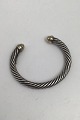 Danam Antik 
presents: 
David 
Yurman Sterling 
Silver / 14K 
Gold Bracelet