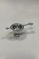 ABSA Tea 
Strainer with 
holder in 
silver plated