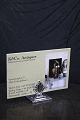 K&Co. presents: 
Georg 
Jensen table 
card holder in 
Queen pattern 
in sterling 
silver. 
Stamped. Johan 
Rohde...