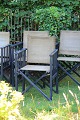 Older 
instructor's 
chair in black 
painted wood 
with ...