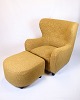 Osted Antik & 
Design 
presents: 
Armchair 
with ottoman - 
Over-
upholstered - 
Patterned 
yellow fabric - 
Black legs ...